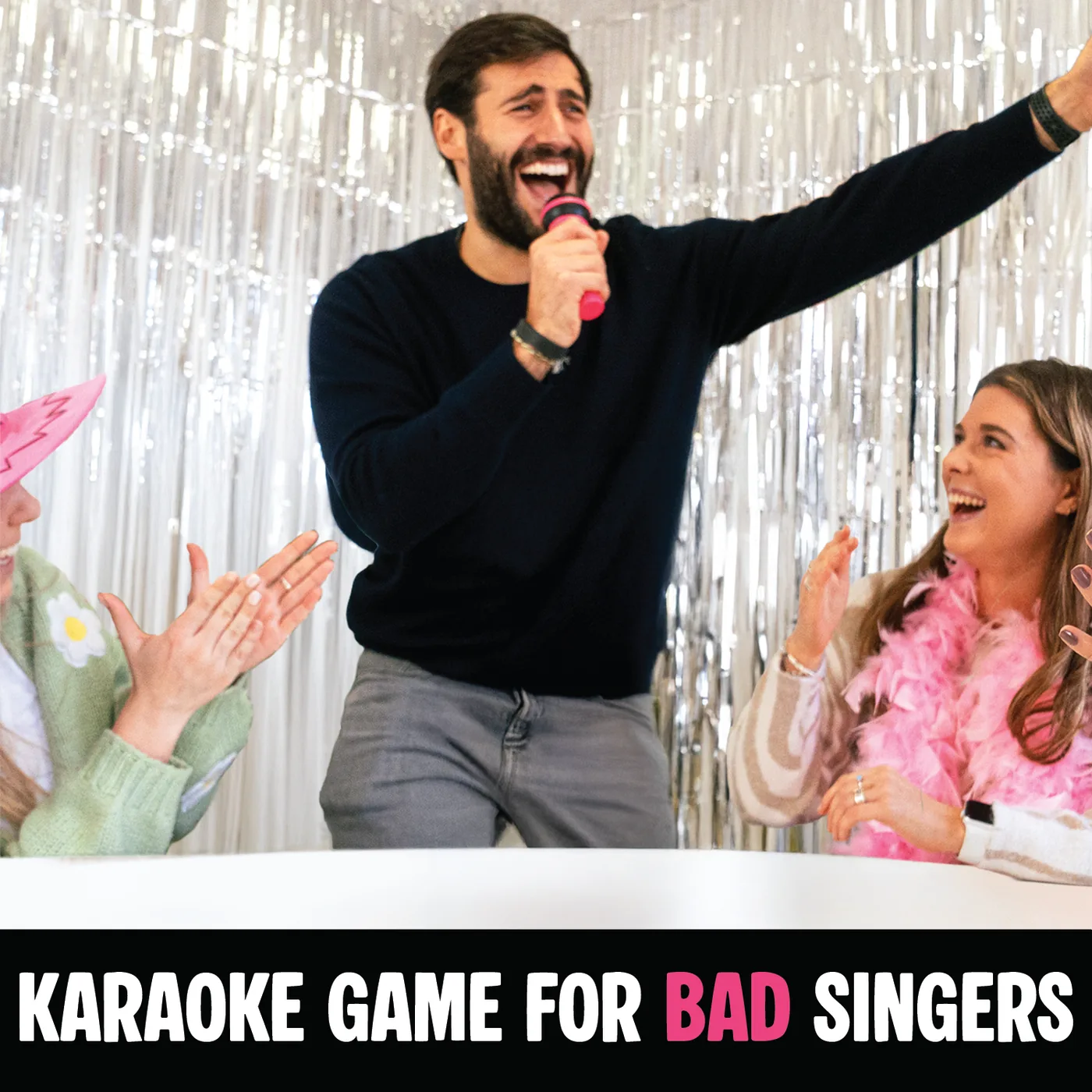 Friends playing Grab The Mic - the karaoke game for bad singers